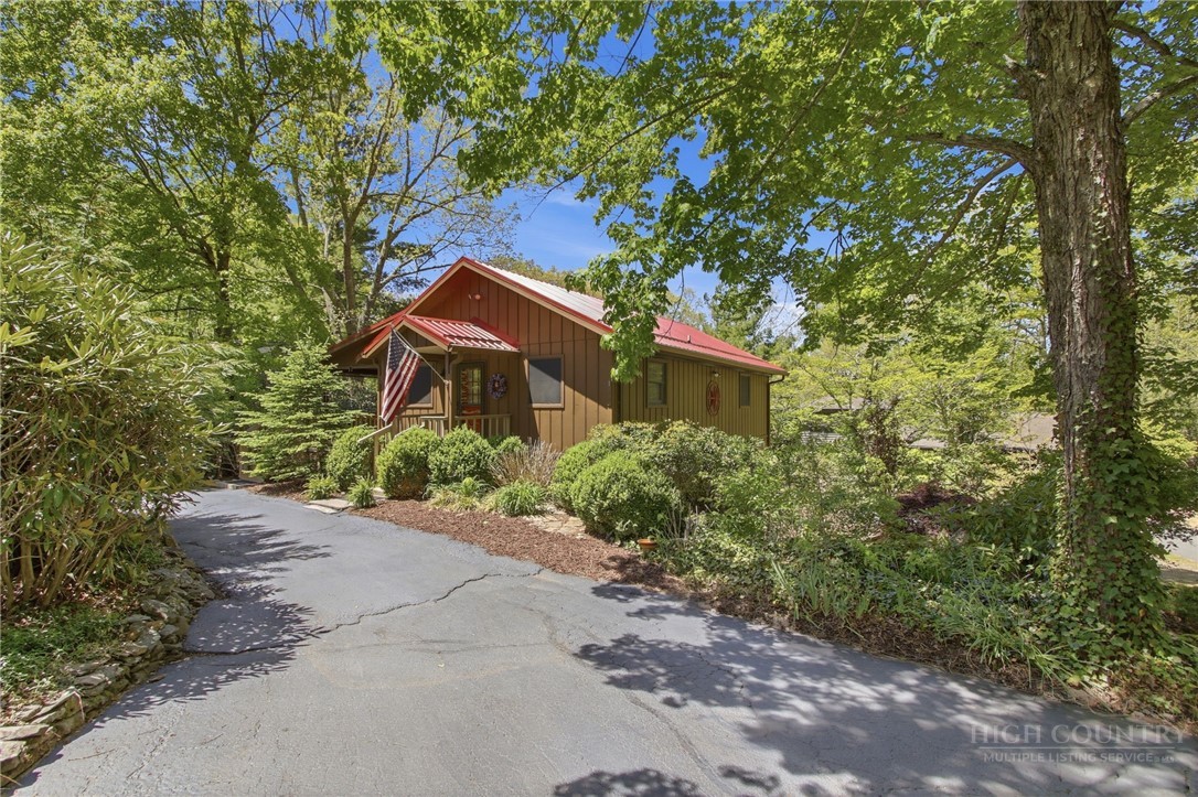 164 Rocky Meadows Road Newland, NC 28657 - Photo 6 of 49 a front view of a house with a garden