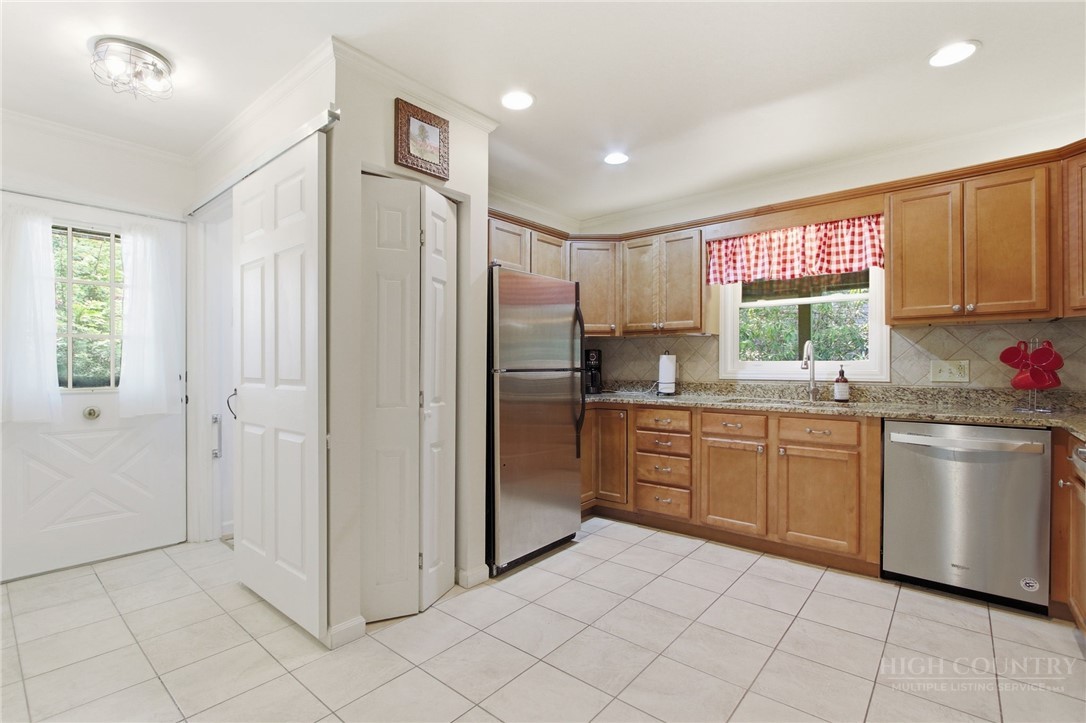 164 Rocky Meadows Road Newland, NC 28657 - Photo 10 of 49 a kitchen with stainless steel appliances granite countertop a refrigerator and a sink