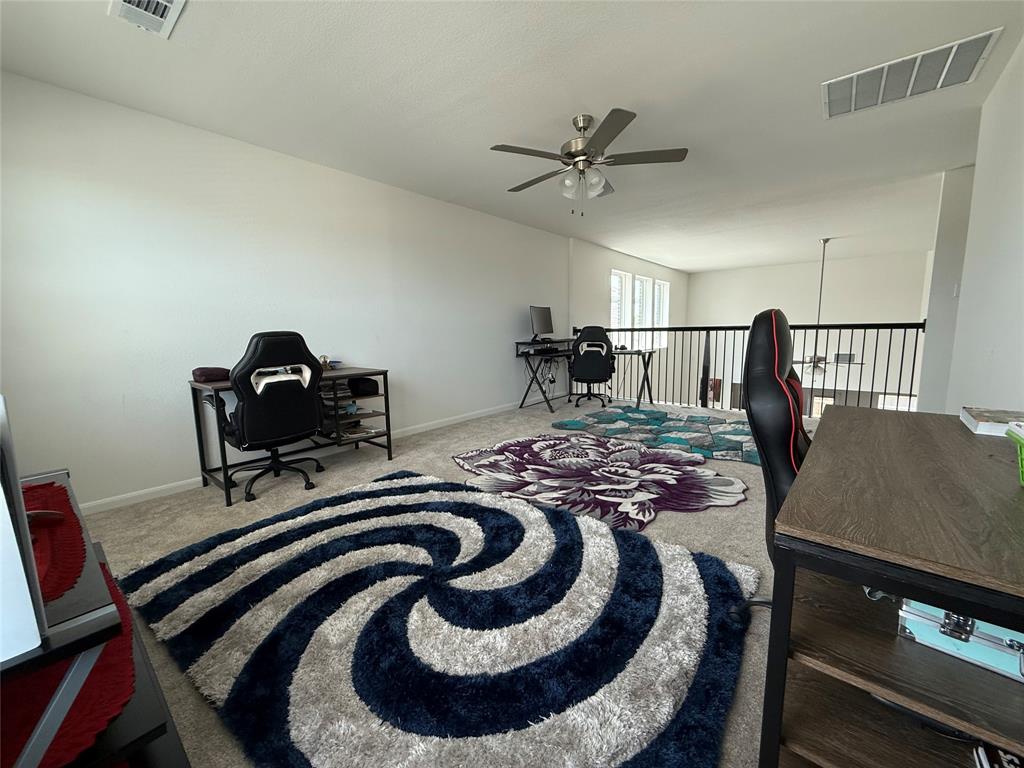 2006 Placerville Street Forney, TX 75126 - Photo 24 of 35 Versatile loft space featuring neutral carpeting, a ceiling fan, and white walls