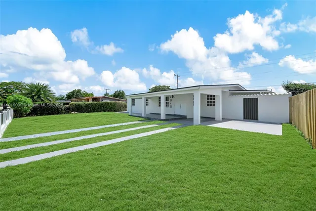 a view of a house with a big yard
