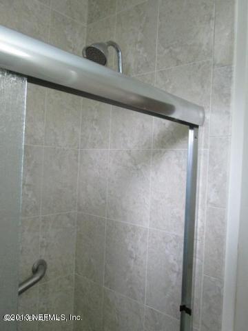 4727 Birkenhead Road Jacksonville, FL 32210 - Photo 8 of 13 a close view of a shower in a bathroom