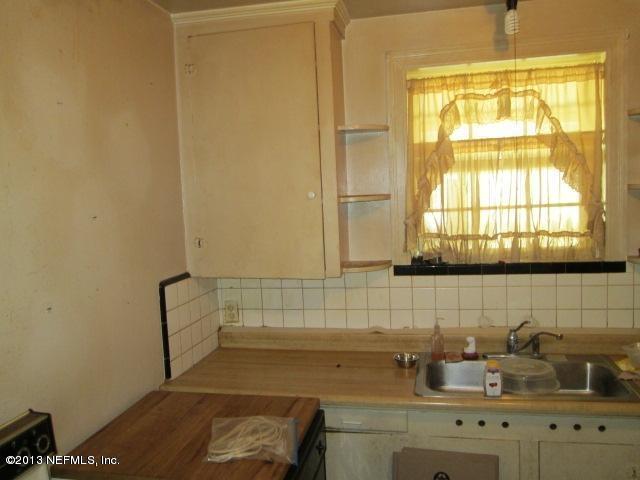 4727 Birkenhead Road Jacksonville, FL 32210 - Photo 9 of 13 a bathroom with a sink and a window
