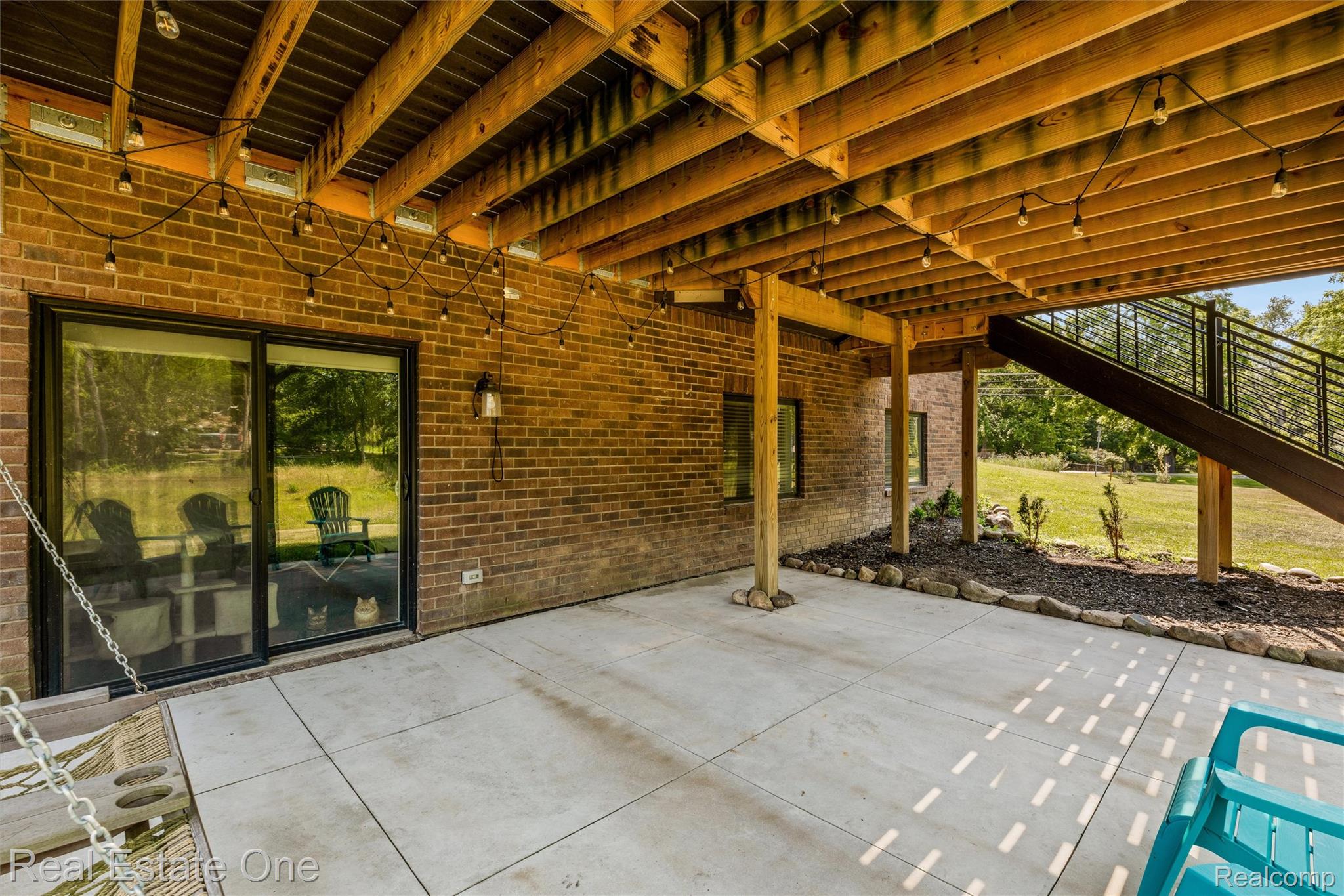 2983 28 Mile Road Washington, MI 48094 - Photo 47 of 54 Concrete patio featuring a brick exterior and sliding glass doors