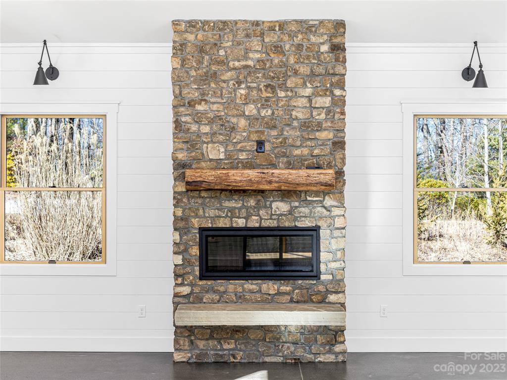 13 Small Crk Road Brevard, NC 28712 - Photo 12 of 48 a living room with a fireplace and a table