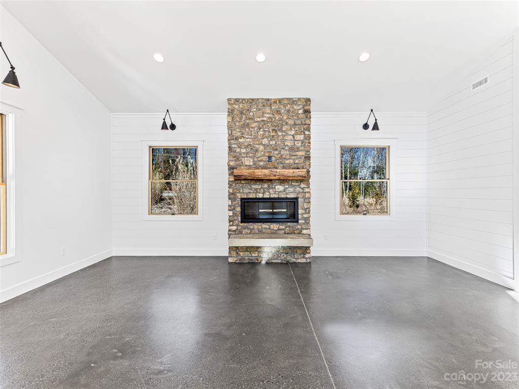13 Small Crk Road Brevard, NC 28712 - Photo 13 of 48 an empty room with windows and fireplace