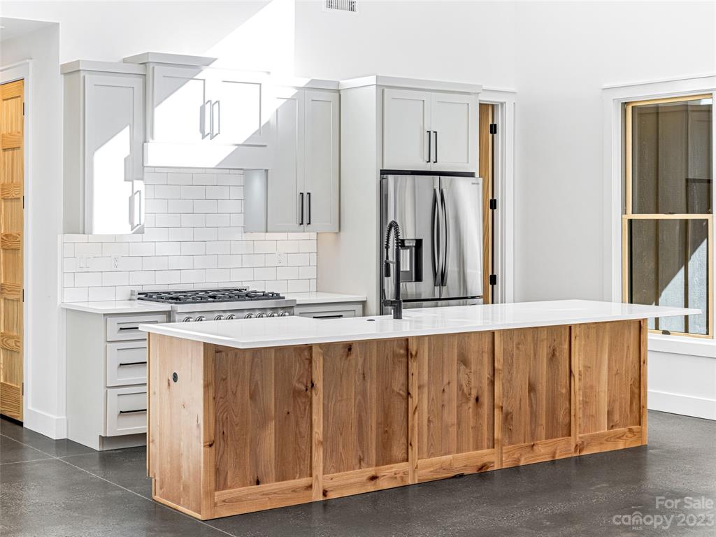 13 Small Crk Road Brevard, NC 28712 - Photo 20 of 48 a kitchen with appliances a sink and cabinets