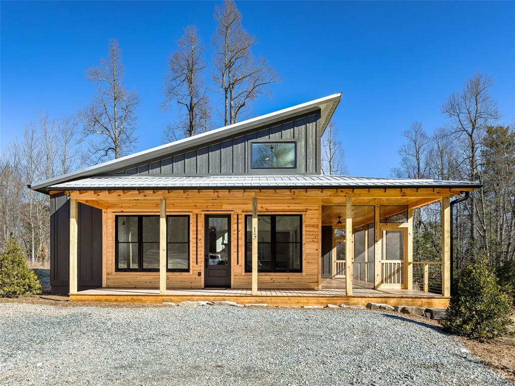 13 Small Crk Road Brevard, NC 28712 - Photo 2 of 48 a front view of building with a garden