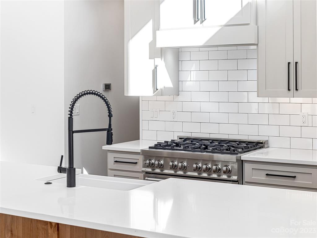 13 Small Crk Road Brevard, NC 28712 - Photo 21 of 48 a kitchen with a stove a sink and a microwave