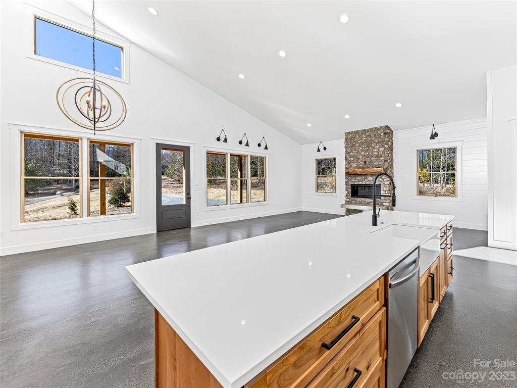 13 Small Crk Road Brevard, NC 28712 - Photo 24 of 48 a view of a kitchen with kitchen island a stove and a table