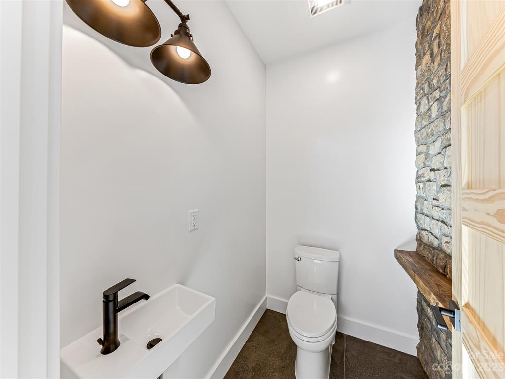 13 Small Crk Road Brevard, NC 28712 - Photo 28 of 48 a bathroom with a toilet and a sink