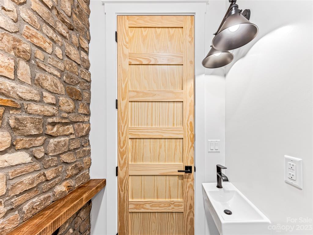 13 Small Crk Road Brevard, NC 28712 - Photo 29 of 48 a bathroom with a sink and a mirror