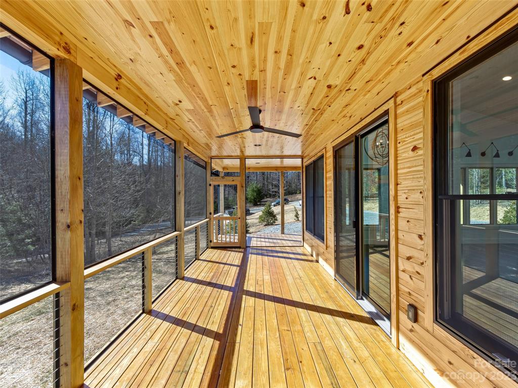 13 Small Crk Road Brevard, NC 28712 - Photo 31 of 48 a view of porch with wooden floor and city view