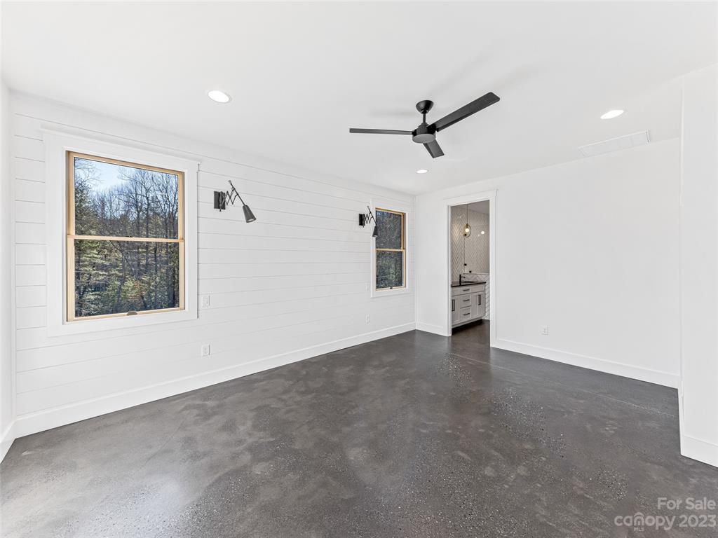 13 Small Crk Road Brevard, NC 28712 - Photo 35 of 48 a view of a livingroom with a ceiling fan and window