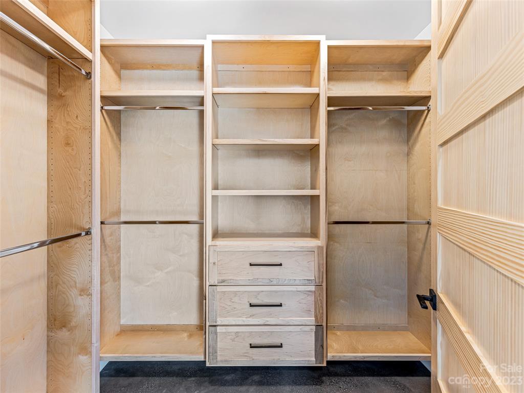 13 Small Crk Road Brevard, NC 28712 - Photo 36 of 48 a view of walk in closet with empty racks