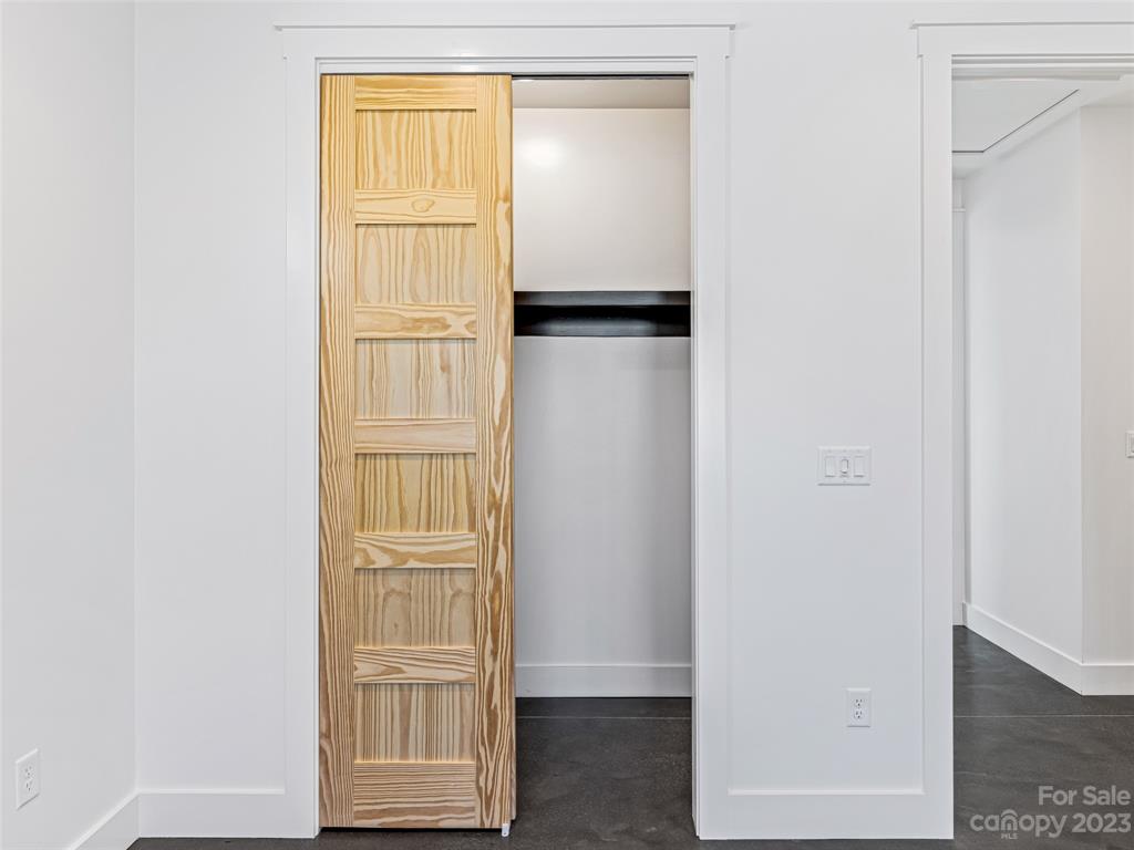 13 Small Crk Road Brevard, NC 28712 - Photo 40 of 48 a view of walk in closet with empty racks