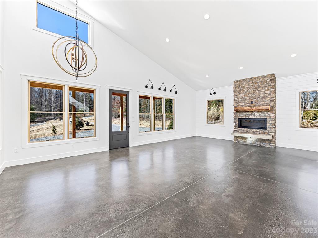 13 Small Crk Road Brevard, NC 28712 - Photo 9 of 48 a view of an empty room with glass door