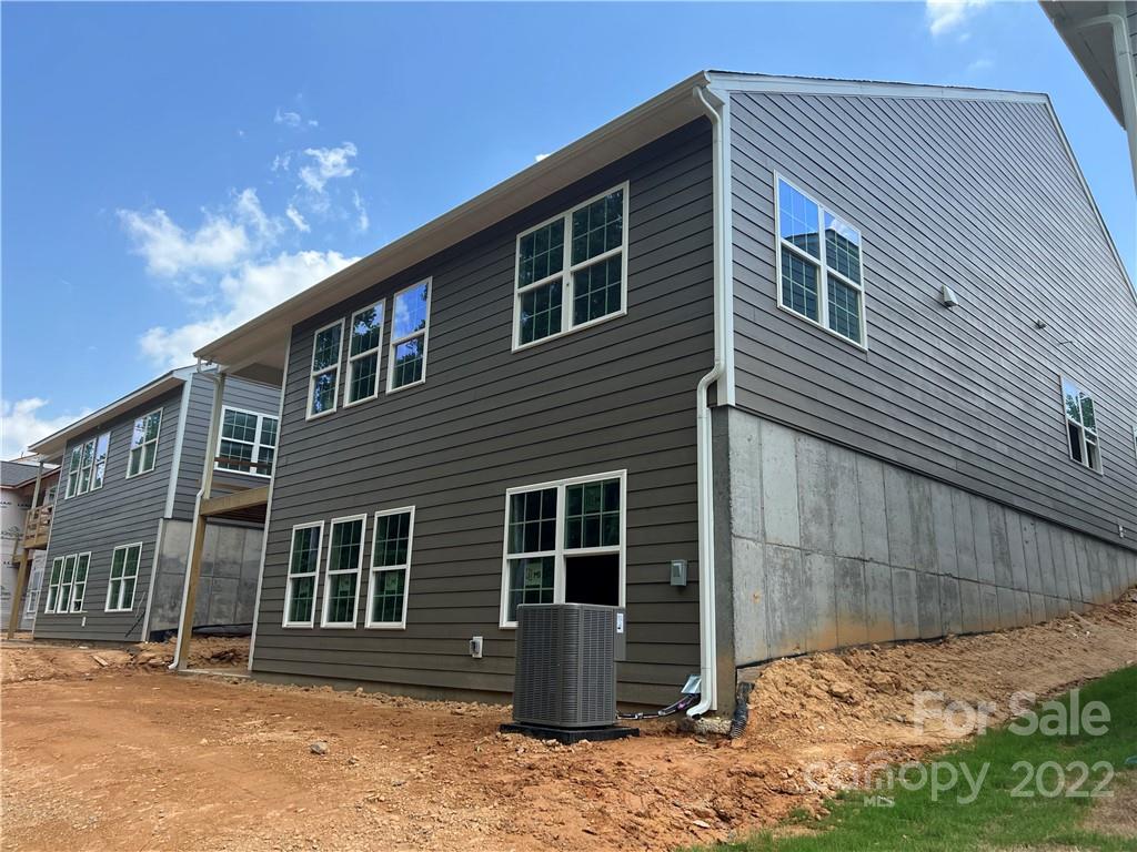 3137 Windhaven Lane, Unit 76 Tega Cay, SC 29708 - Photo 11 of 15 a front view of a house with a yard