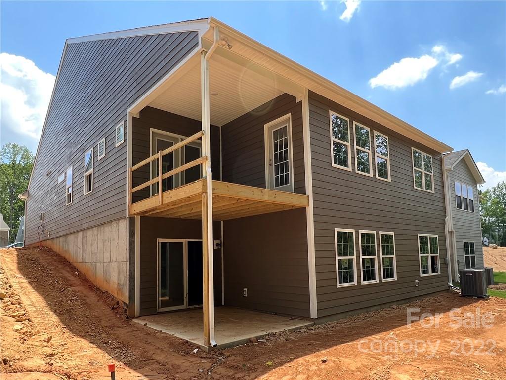 3137 Windhaven Lane, Unit 76 Tega Cay, SC 29708 - Photo 9 of 15 a front view of a house with a yard
