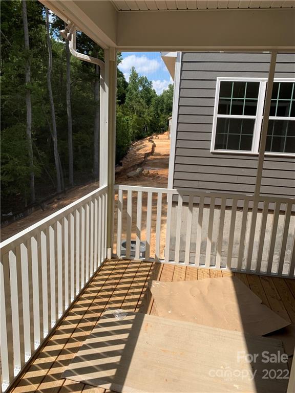 3137 Windhaven Lane, Unit 76 Tega Cay, SC 29708 - Photo 10 of 15 a view of a balcony with wooden floor
