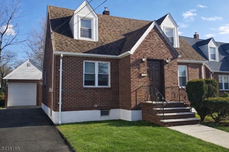 1301 Madison Hill Road Rahway, NJ 07065 - Photo 2 of 14 a front view of a house with garden