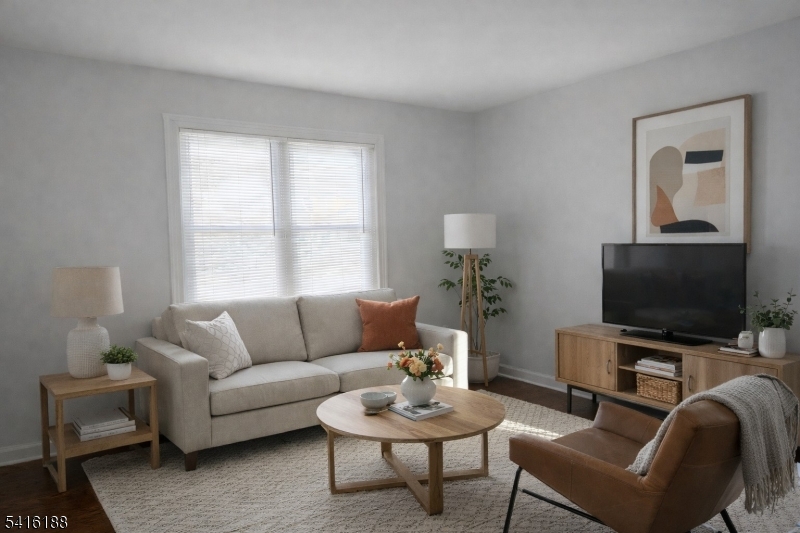 1301 Madison Hill Road Rahway, NJ 07065 - Photo 3 of 14 a living room with furniture and a flat screen tv