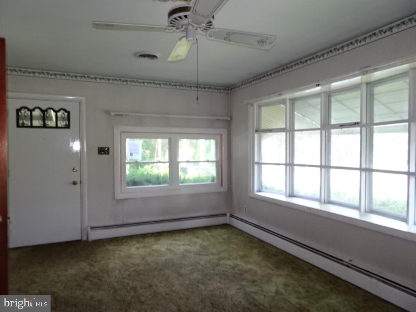 1021 Shelbourne Road Reading, PA 19606 - Photo 14 of 15 a view of an empty room with a window