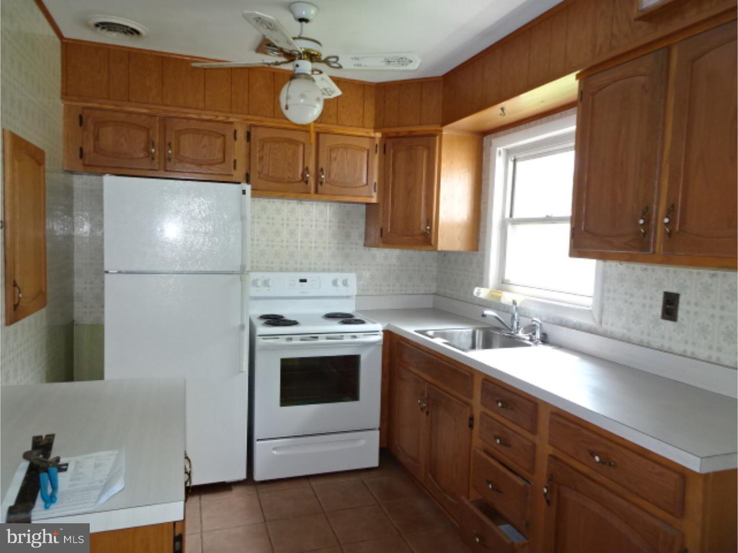 1021 Shelbourne Road Reading, PA 19606 - Photo 8 of 15 a kitchen with a sink cabinets and stainless steel appliances
