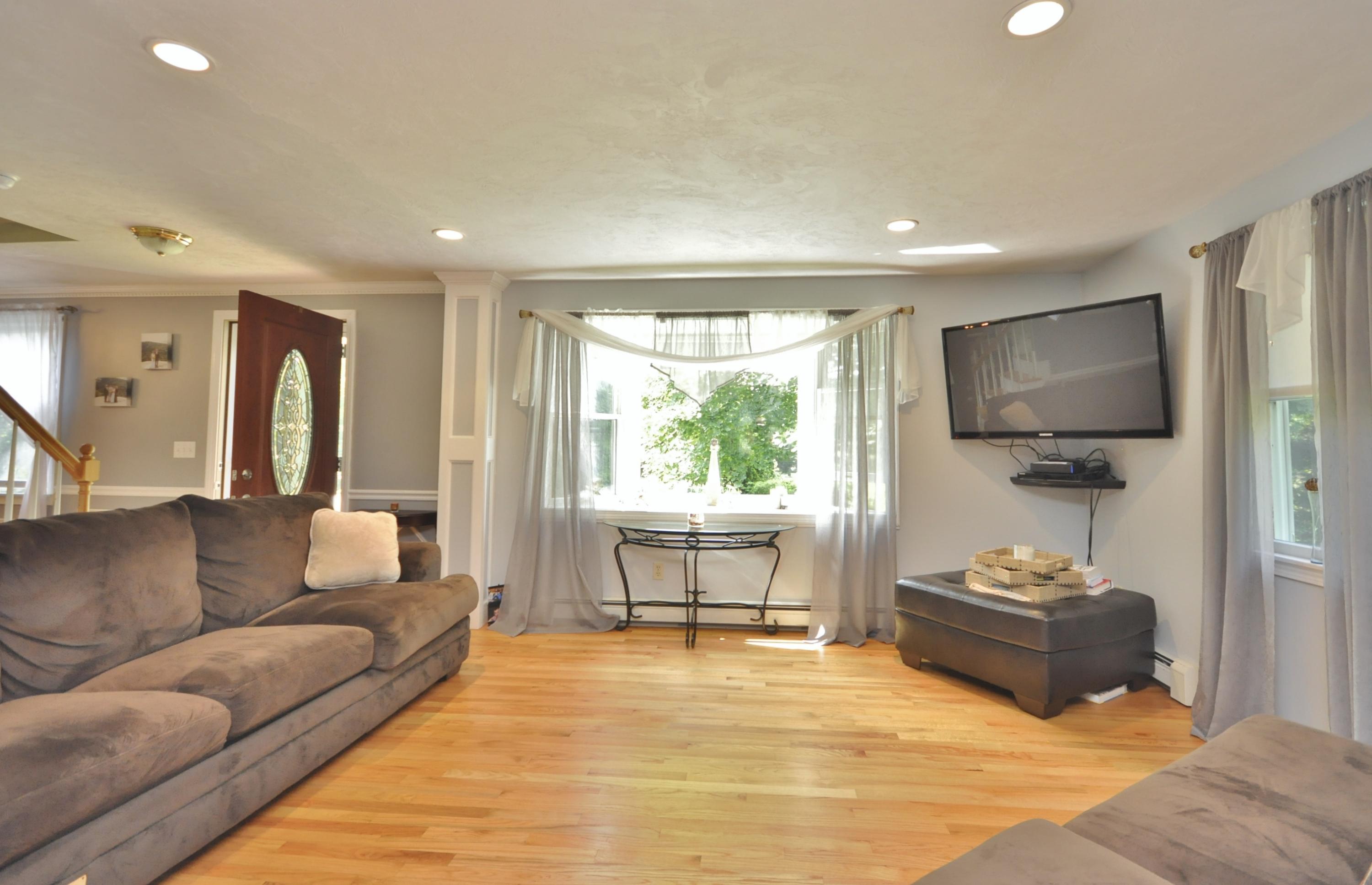 29 Swift Road Sagamore Beach, MA 02562 - Photo 13 of 34 a living room with furniture and a flat screen tv