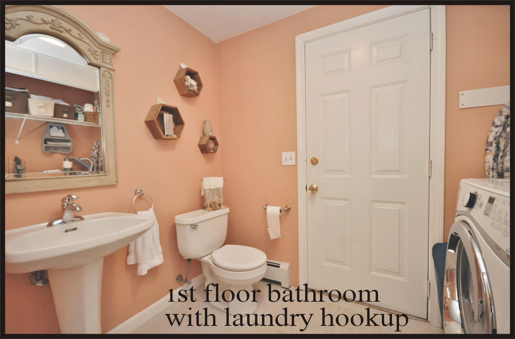 29 Swift Road Sagamore Beach, MA 02562 - Photo 14 of 34 a bathroom with a toilet a sink and a mirror