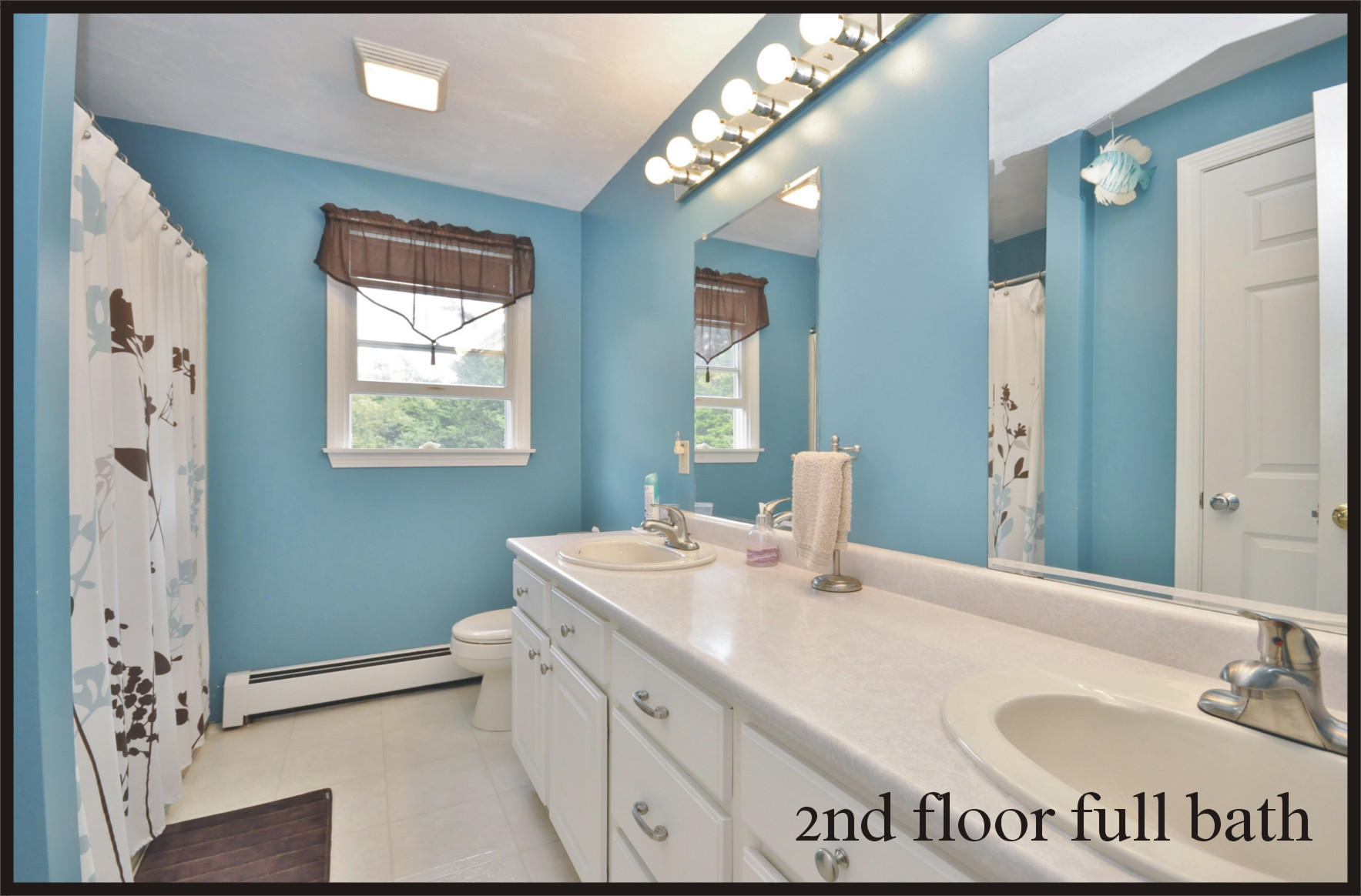 29 Swift Road Sagamore Beach, MA 02562 - Photo 25 of 34 a en suite bathroom with a sink a mirror and a bathtub