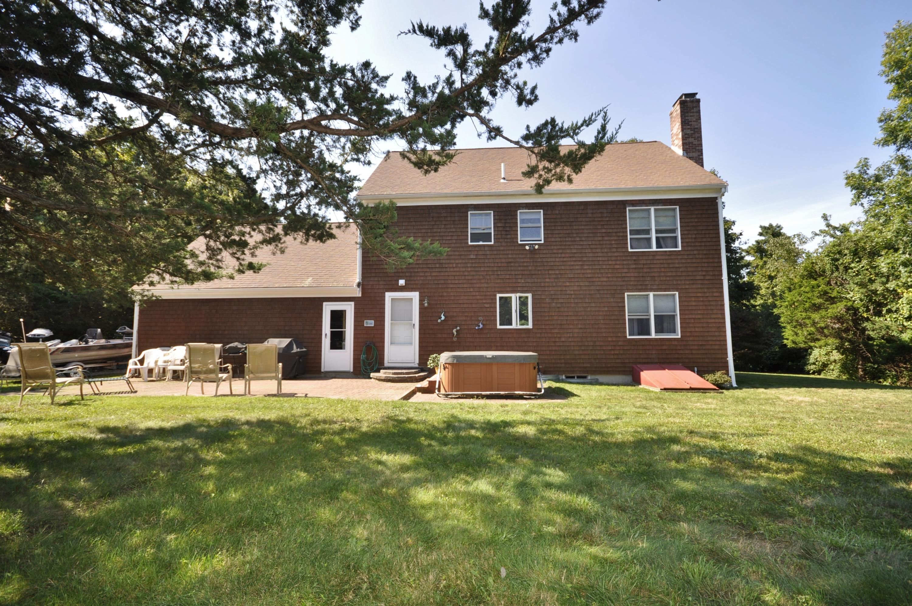 29 Swift Road Sagamore Beach, MA 02562 - Photo 31 of 34 a front view of house with yard and trees in the background