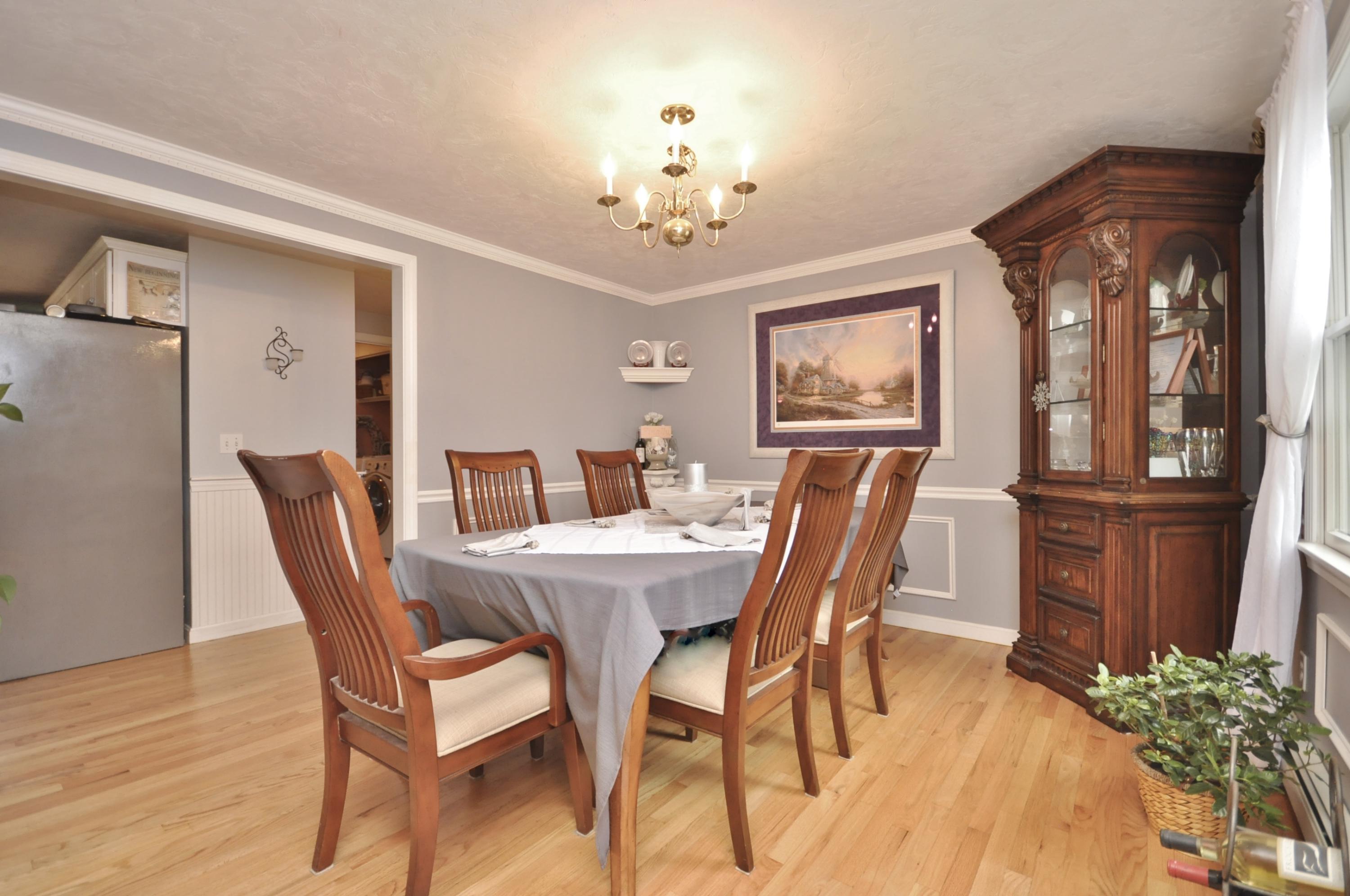 29 Swift Road Sagamore Beach, MA 02562 - Photo 8 of 34 a view of a dining room with furniture window and wooden floor