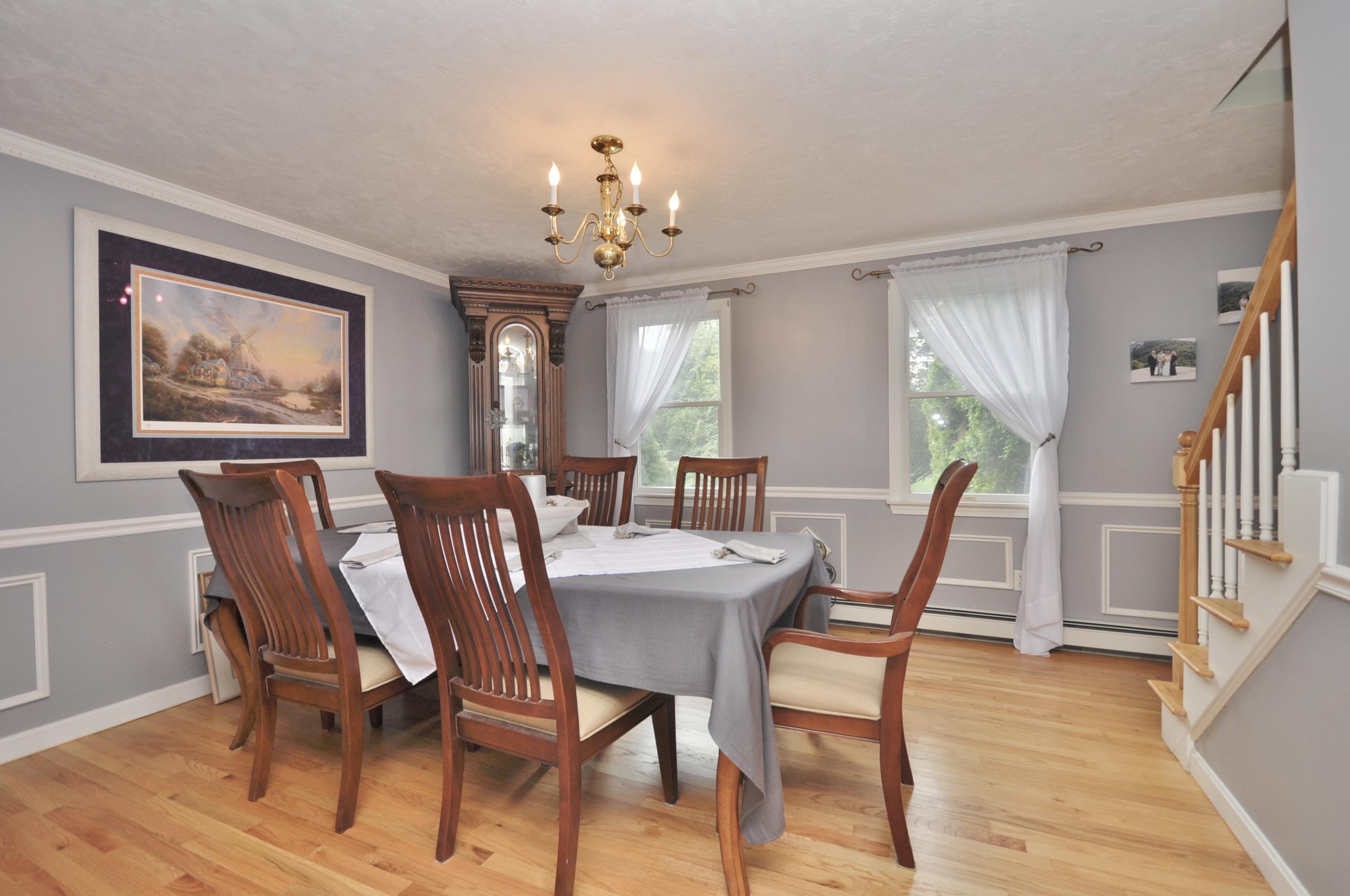 29 Swift Road Sagamore Beach, MA 02562 - Photo 9 of 34 a view of a dining room with furniture and wooden floor