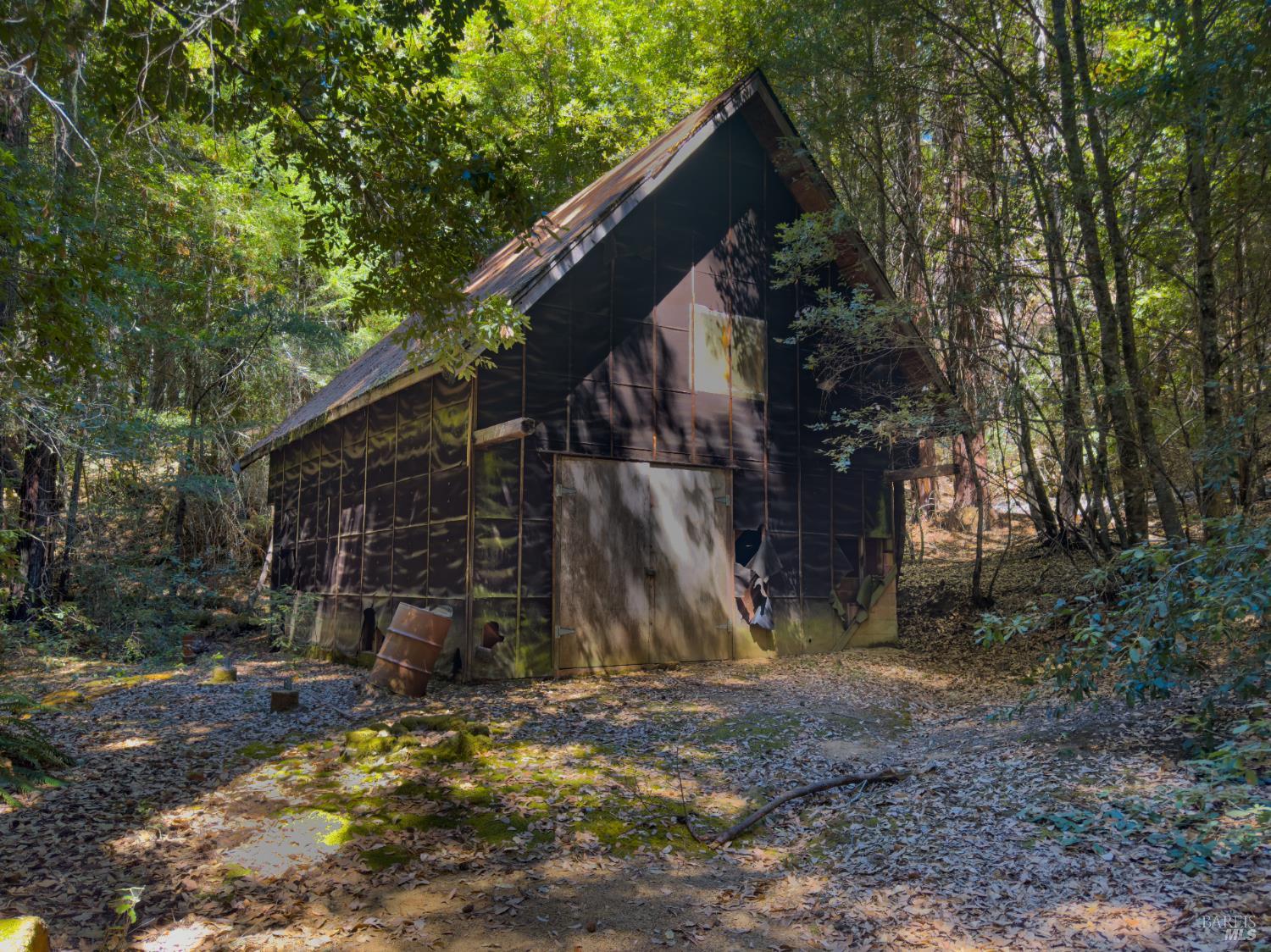 a view of a wooden house with a yard