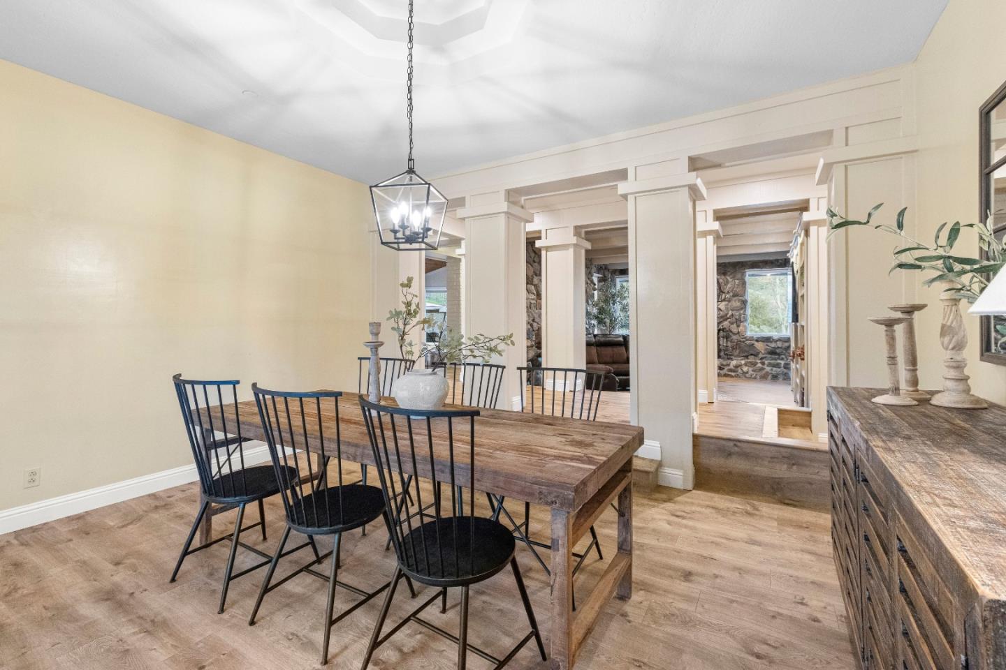 6915 Redwood Retreat Road Gilroy, CA 95020 - Photo 25 of 141 a view of a dining room with furniture wooden floor and chandelier