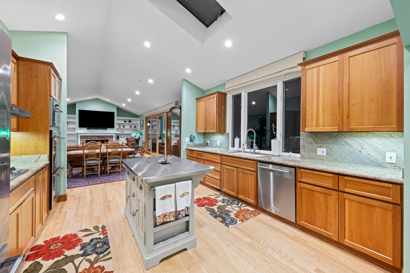 6915 Redwood Retreat Road Gilroy, CA 95020 - Photo 42 of 141 a living room with stainless steel appliances furniture and a flat screen tv