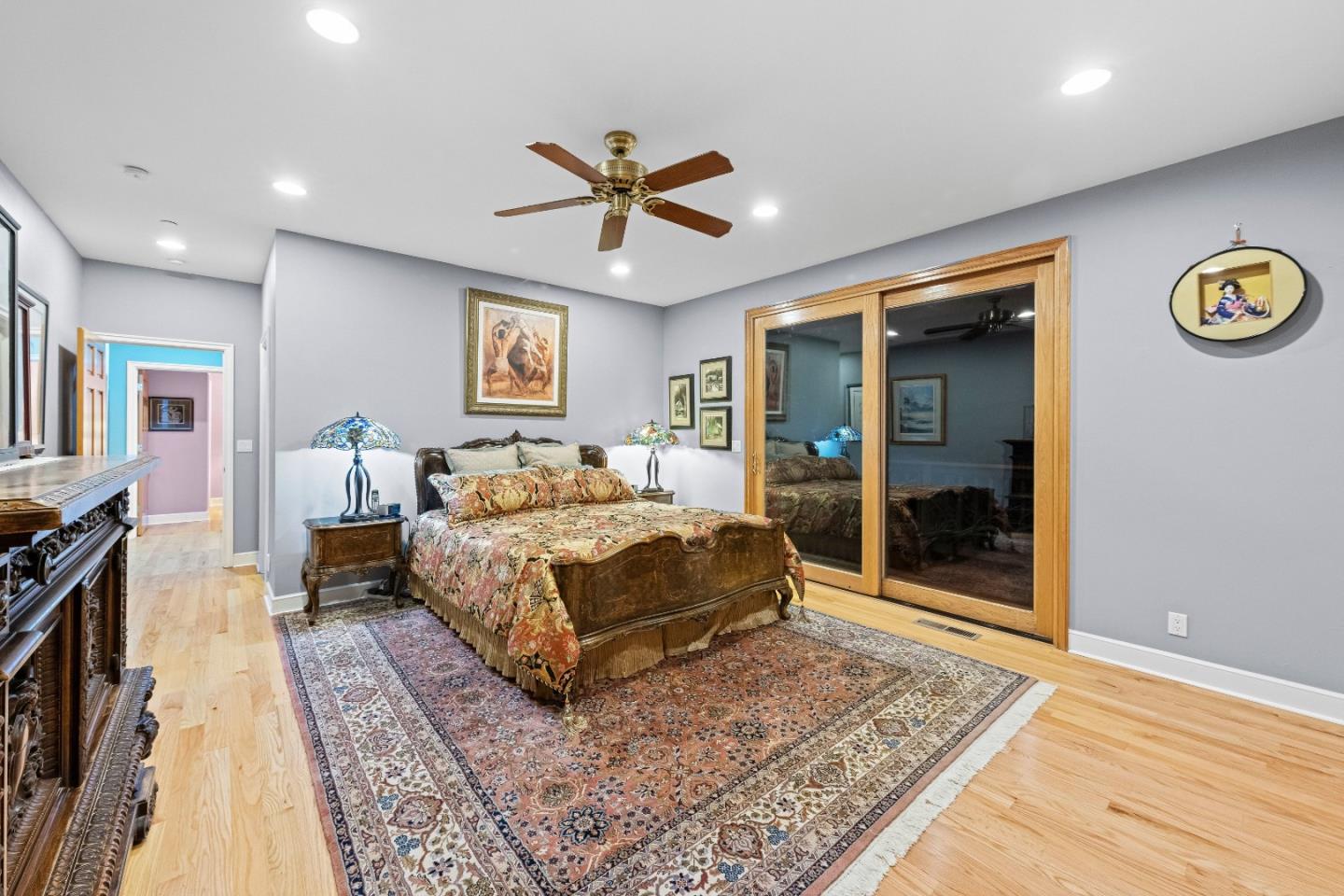 6915 Redwood Retreat Road Gilroy, CA 95020 - Photo 52 of 141 a bedroom with a bed and a chandelier