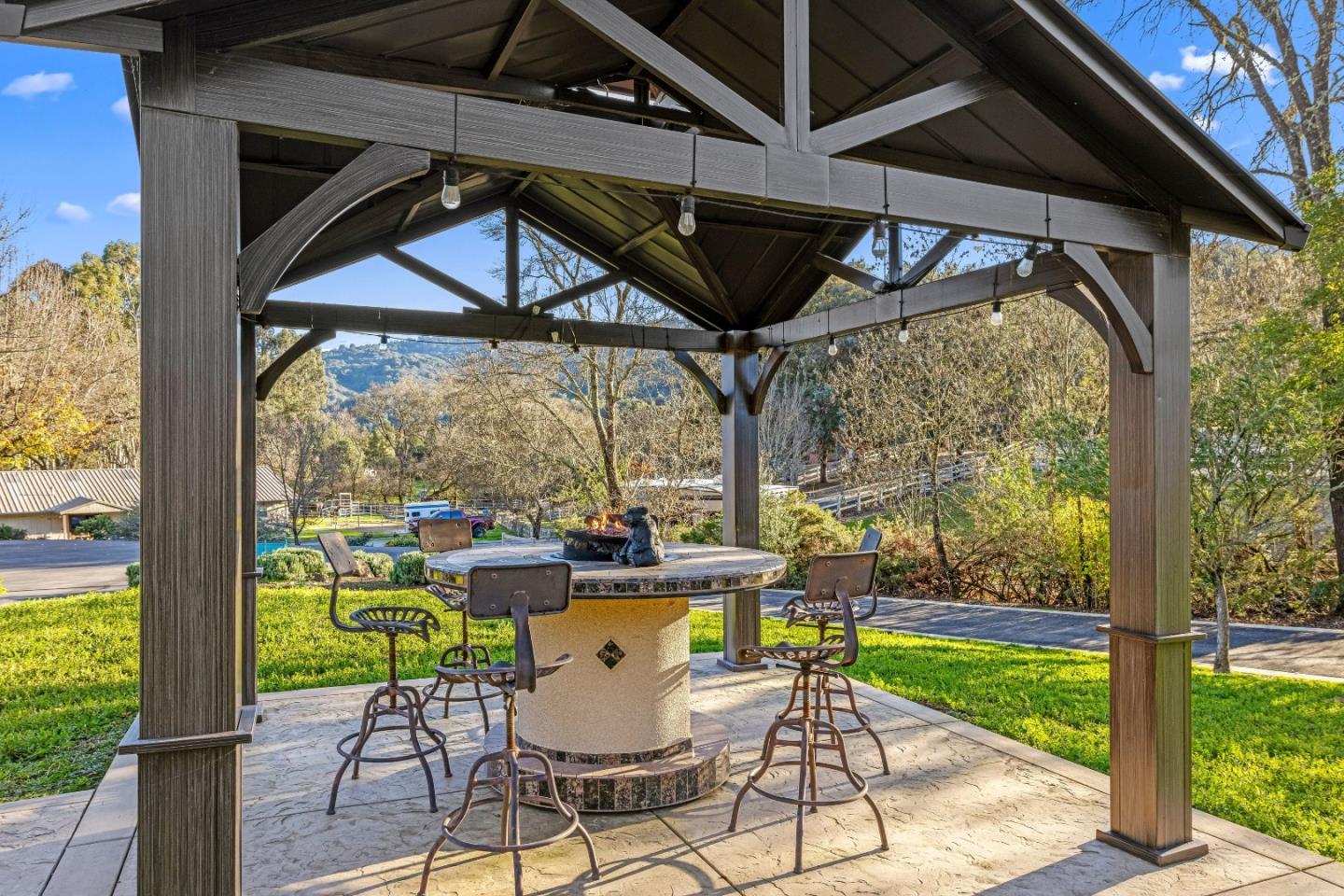 6915 Redwood Retreat Road Gilroy, CA 95020 - Photo 73 of 141 a view of a porch with furniture and wooden floor