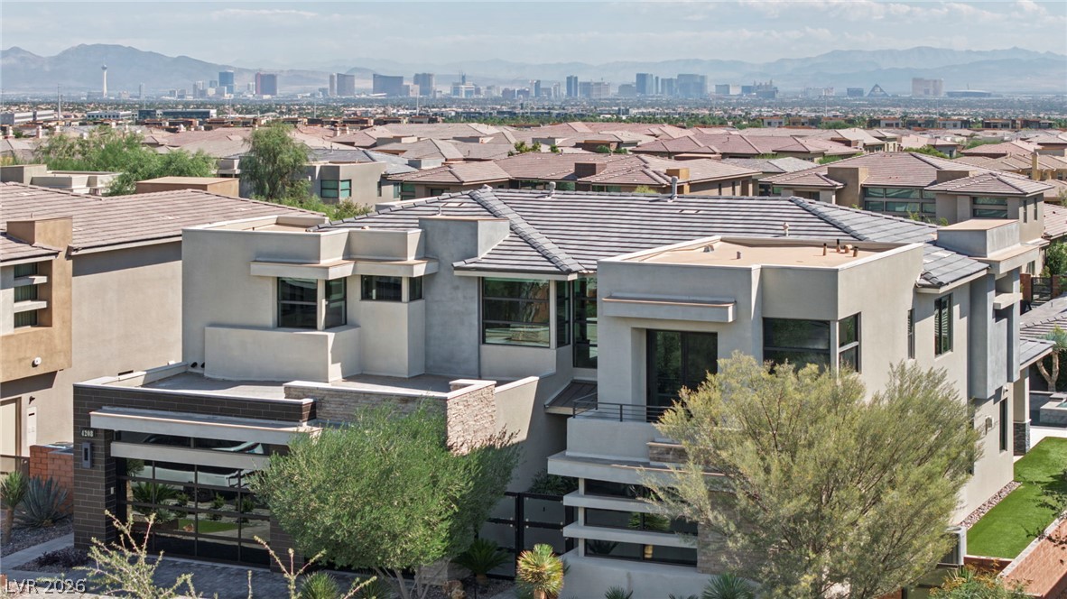 4208 Lapis Ridge Court Las Vegas, NV 89135 - Photo 53 of 61 Distant skyline views frame this modern estate featuring clean architectural lines and flat-roof elevations.