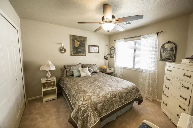 a bedroom with a bed and a dresser