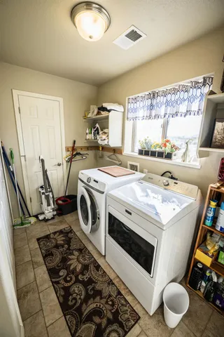 a utility room with dryer and washer
