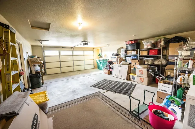 a bedroom with furniture and a flat screen tv