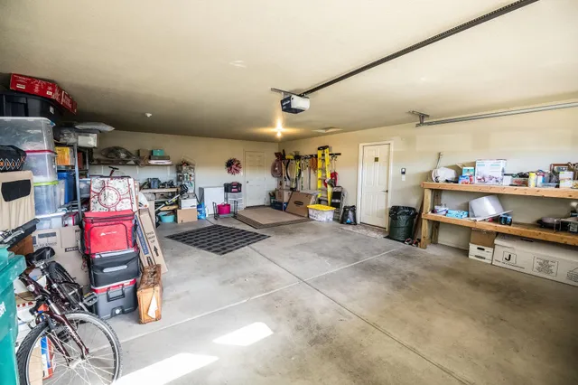 a couple of chairs sitting in backyard of house