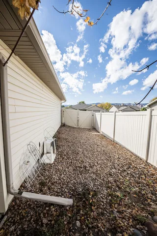 a view of a backyard with pathway