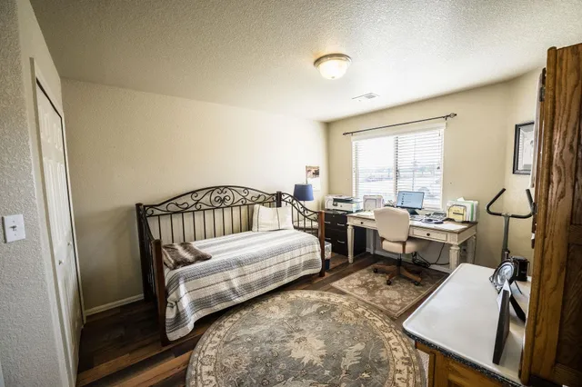 a bedroom with two beds and a window