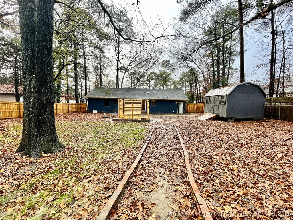 1603 Hickory Ridge Court Fayetteville, NC 28304 - Photo 17 of 17 a front view of a house with a garden