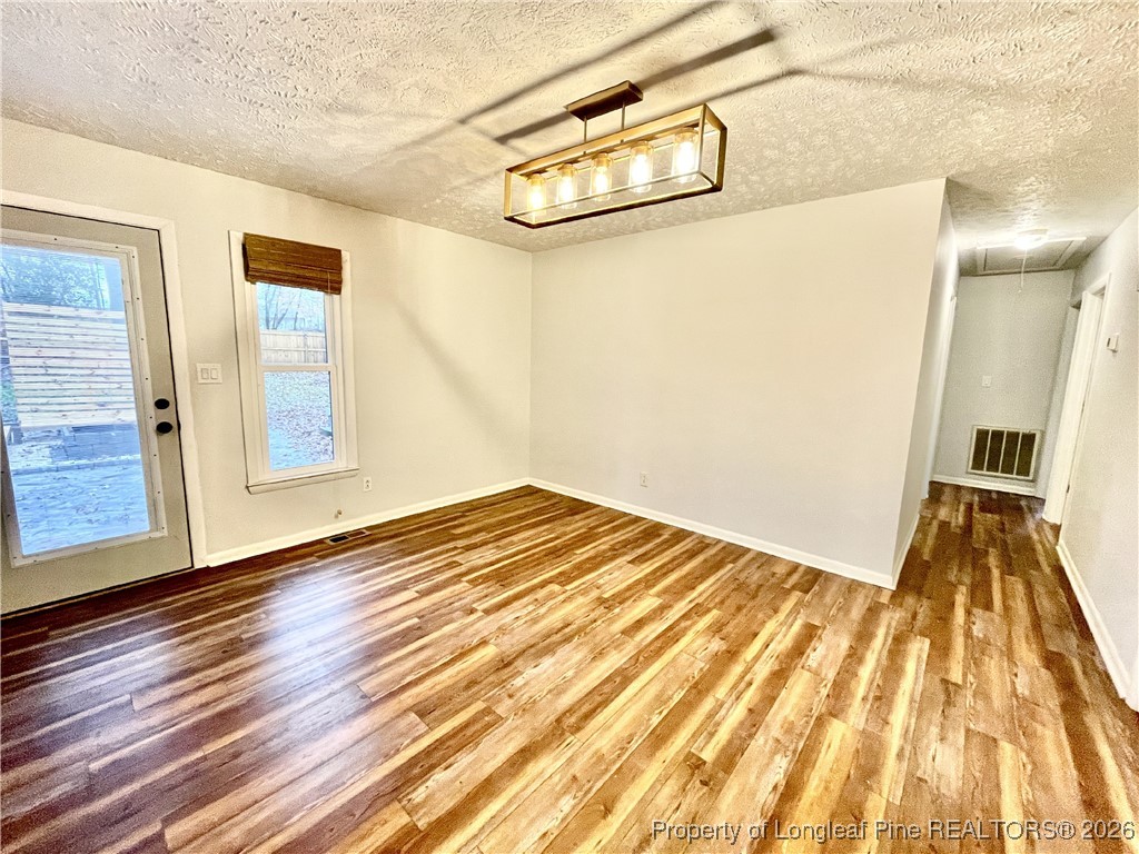 1603 Hickory Ridge Court Fayetteville, NC 28304 - Photo 4 of 17 a view of a room with wooden floor and door