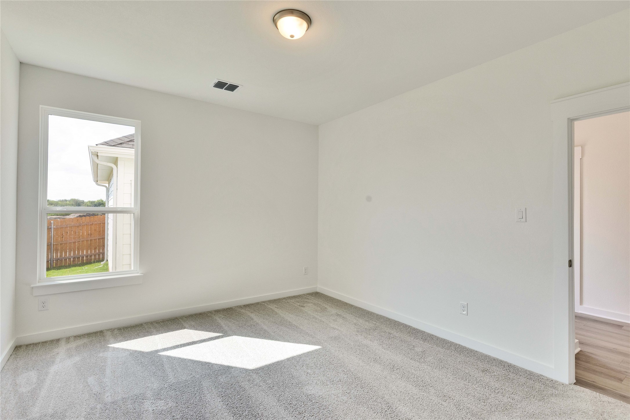13504 Muny Parkway Elgin, TX 78621 - Photo 9 of 15 an empty room with a window