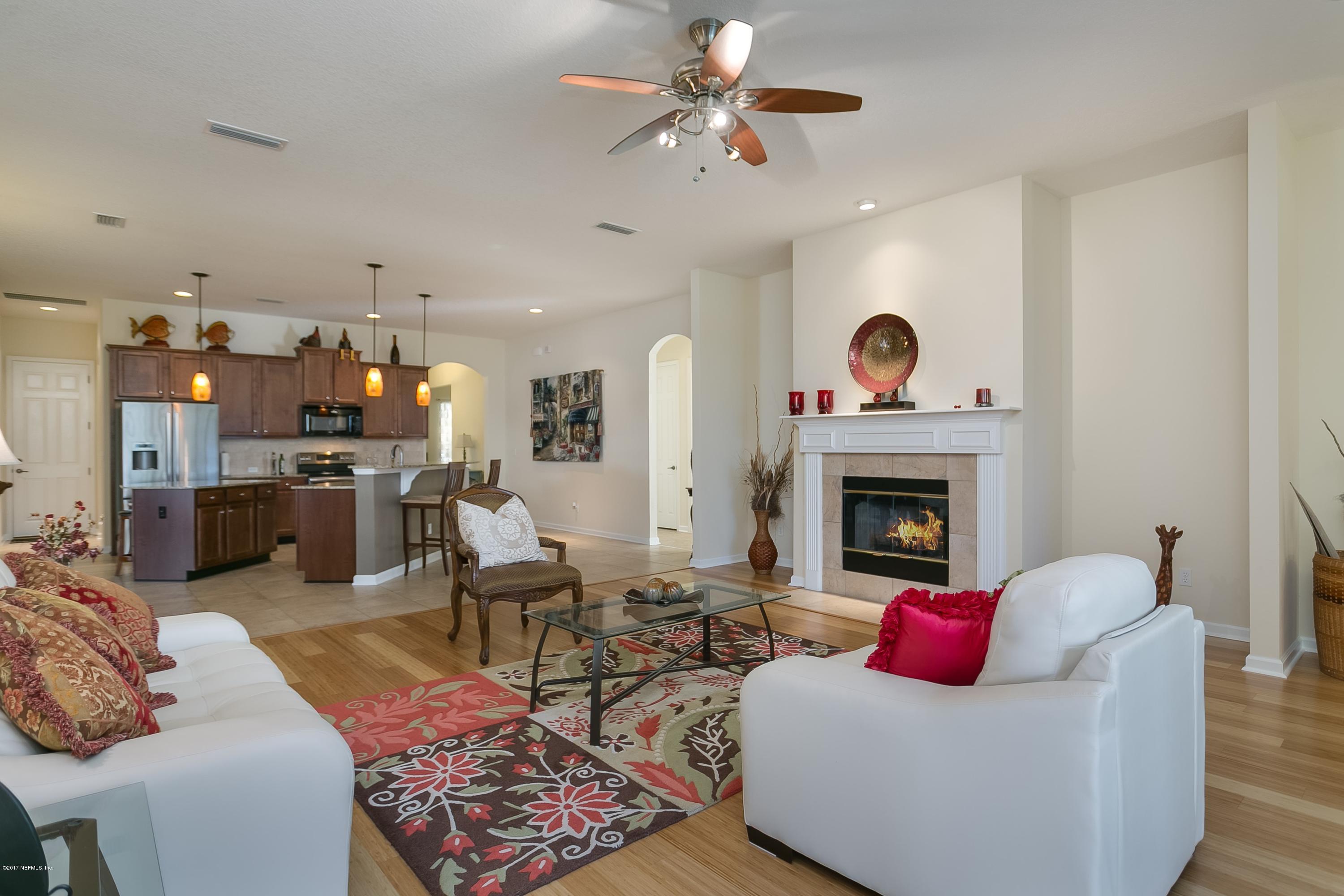 660 Porta Rosa Circle St. Augustine, FL 32092 - Photo 11 of 32 a living room with furniture and a fireplace