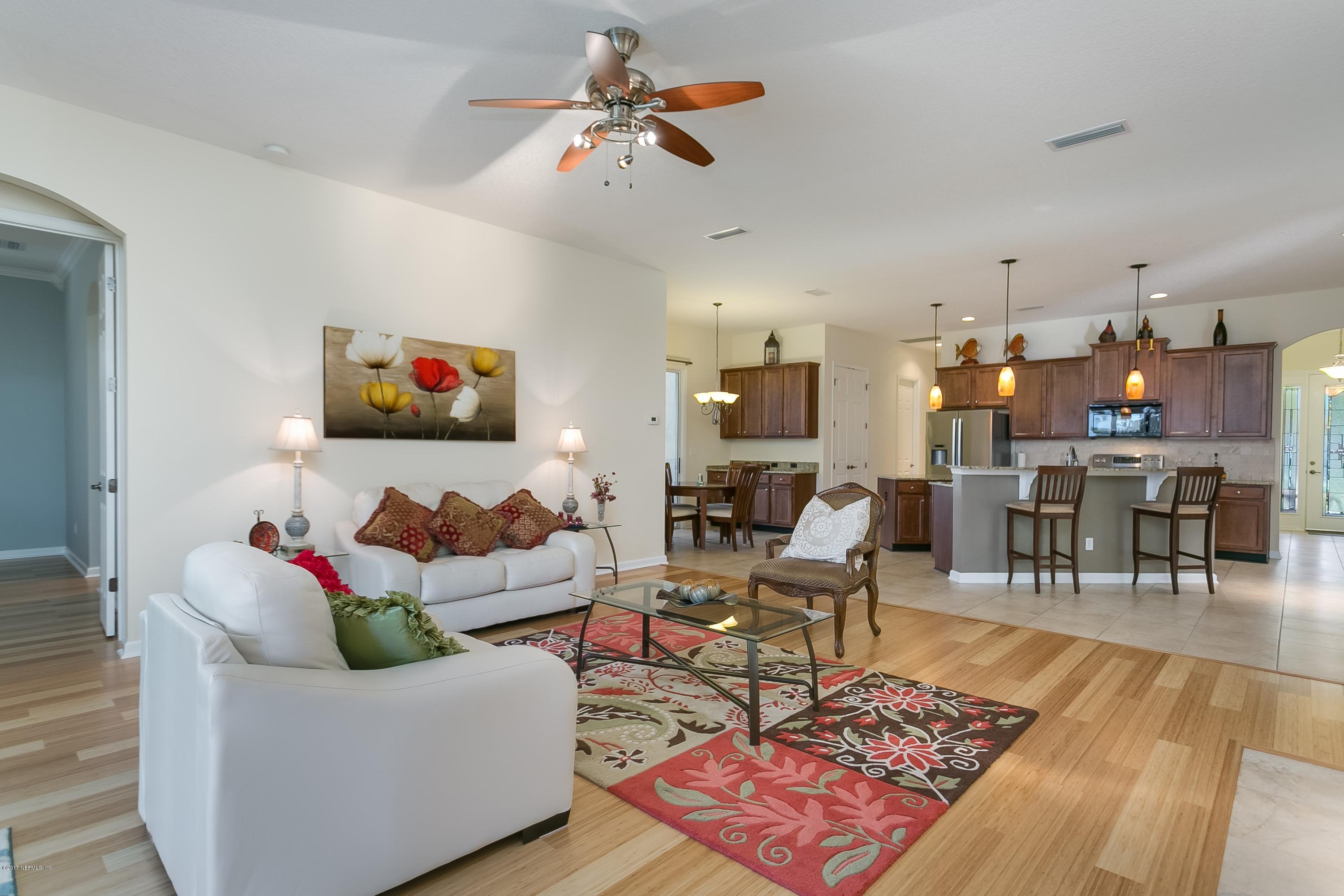 660 Porta Rosa Circle St. Augustine, FL 32092 - Photo 12 of 32 a living room with furniture and a flat screen tv